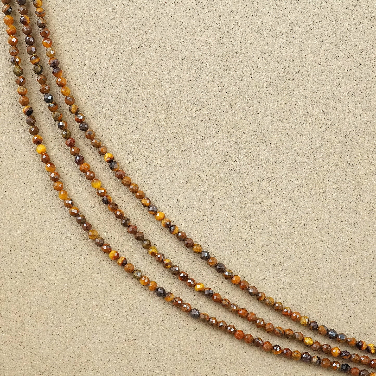Tiger Eye (Round)(Micro)(Faceted)(2mm)(15"Strand)