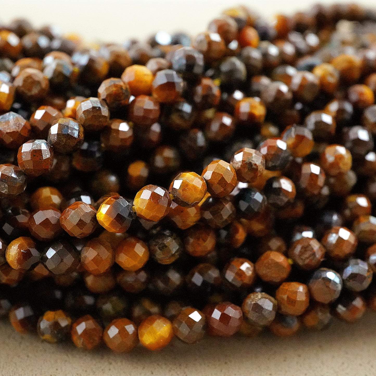 Tiger Eye (Round)(Micro)(Faceted)(2mm)(15"Strand)