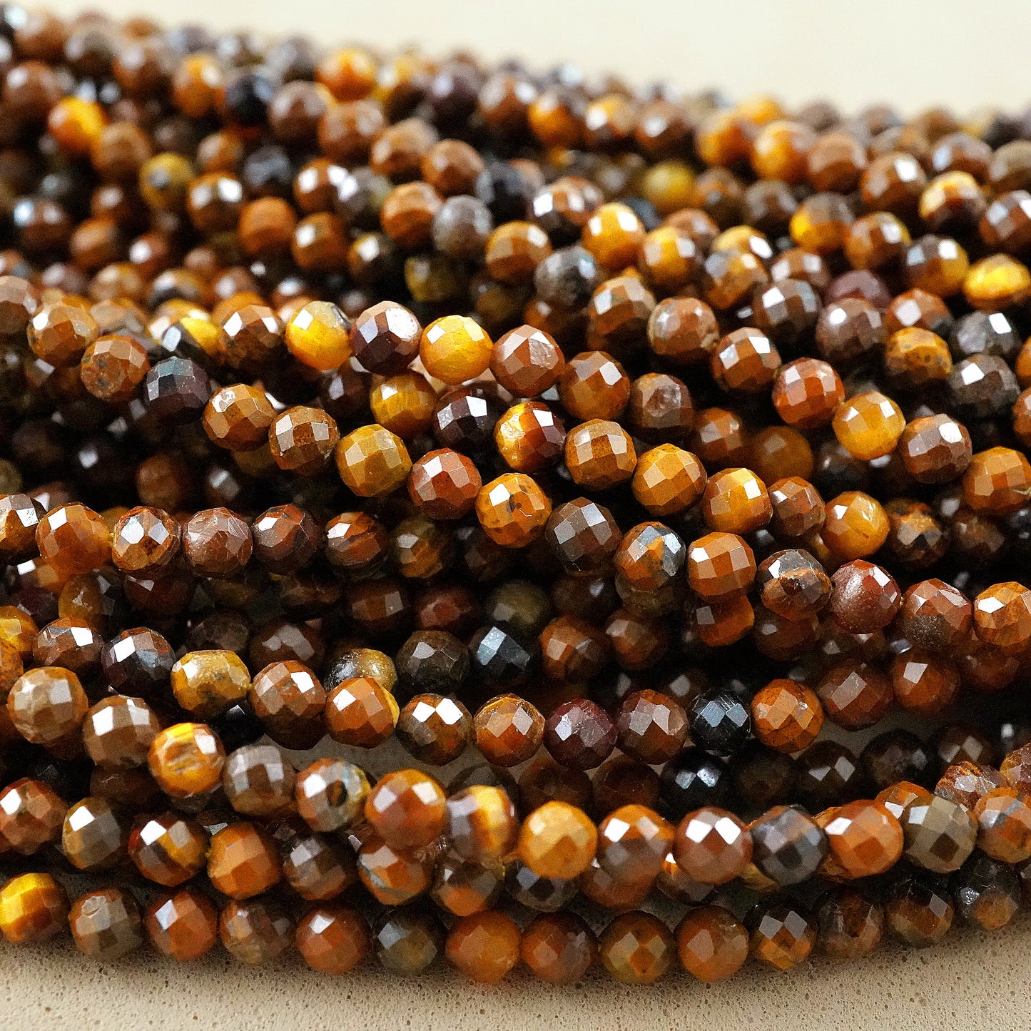 Tiger Eye (Round)(Micro)(Faceted)(2mm)(15"Strand)