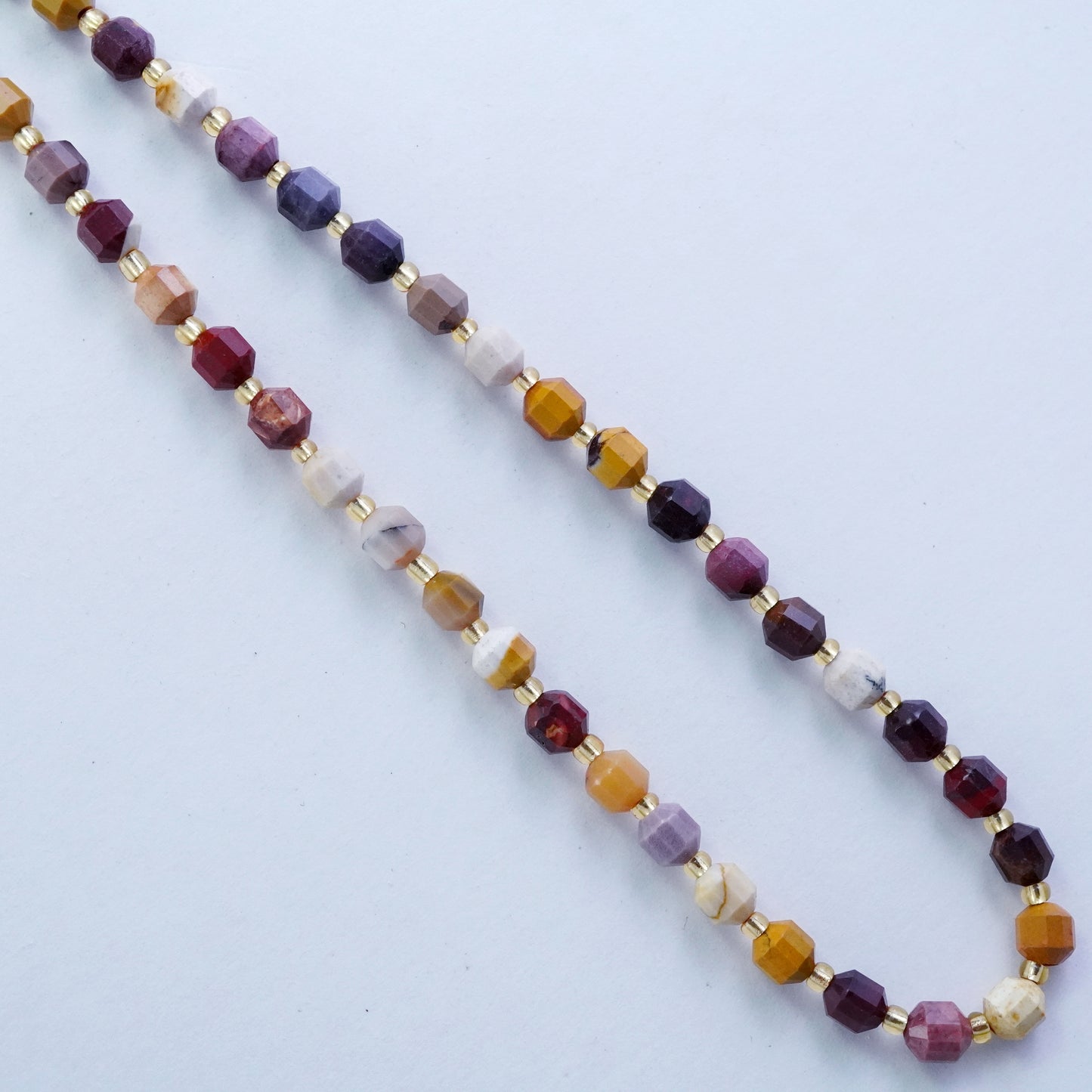 Mookaite (Barrel)(Faceted)(6x5mm)(16"Strand)