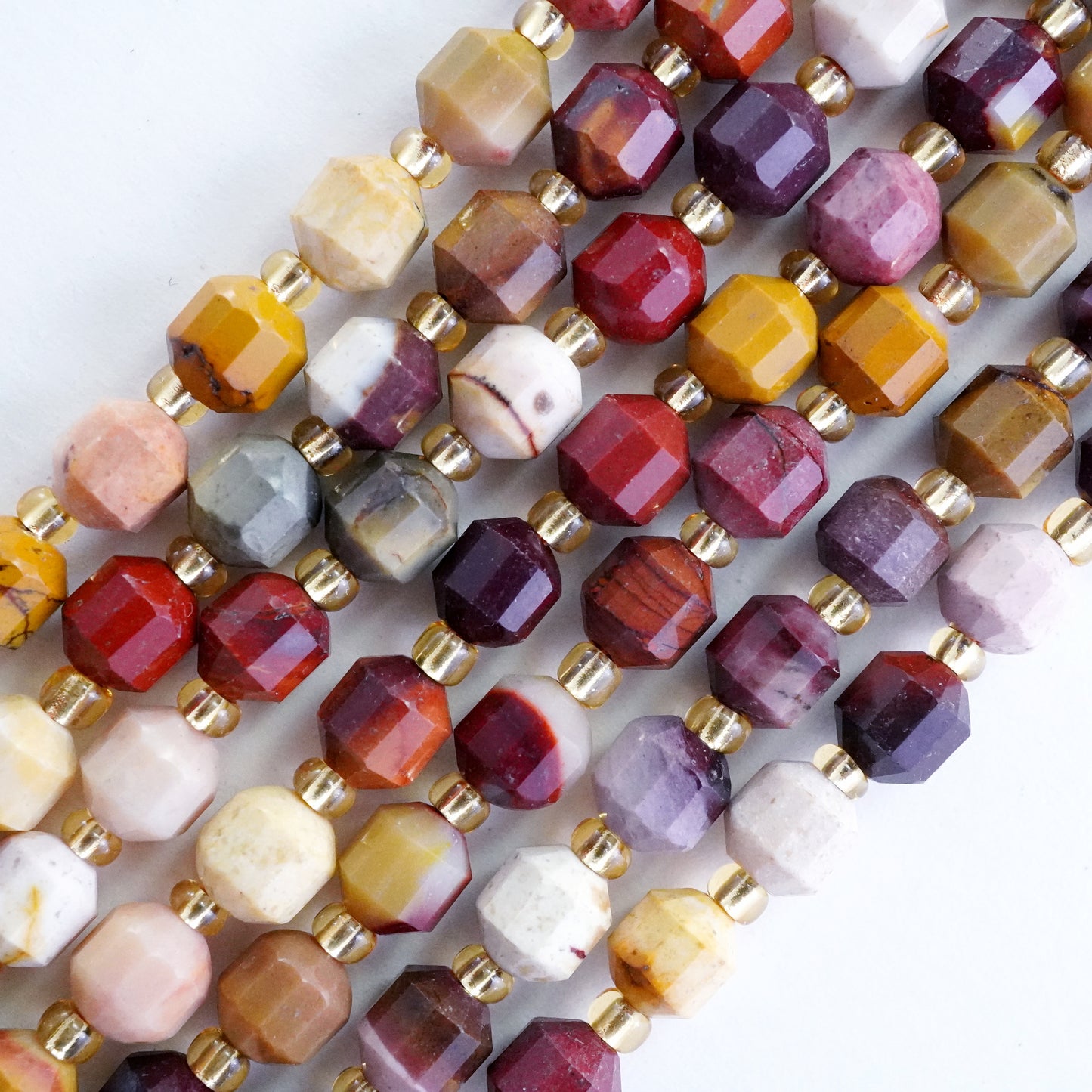 Mookaite (Barrel)(Faceted)(6x5mm)(16"Strand)
