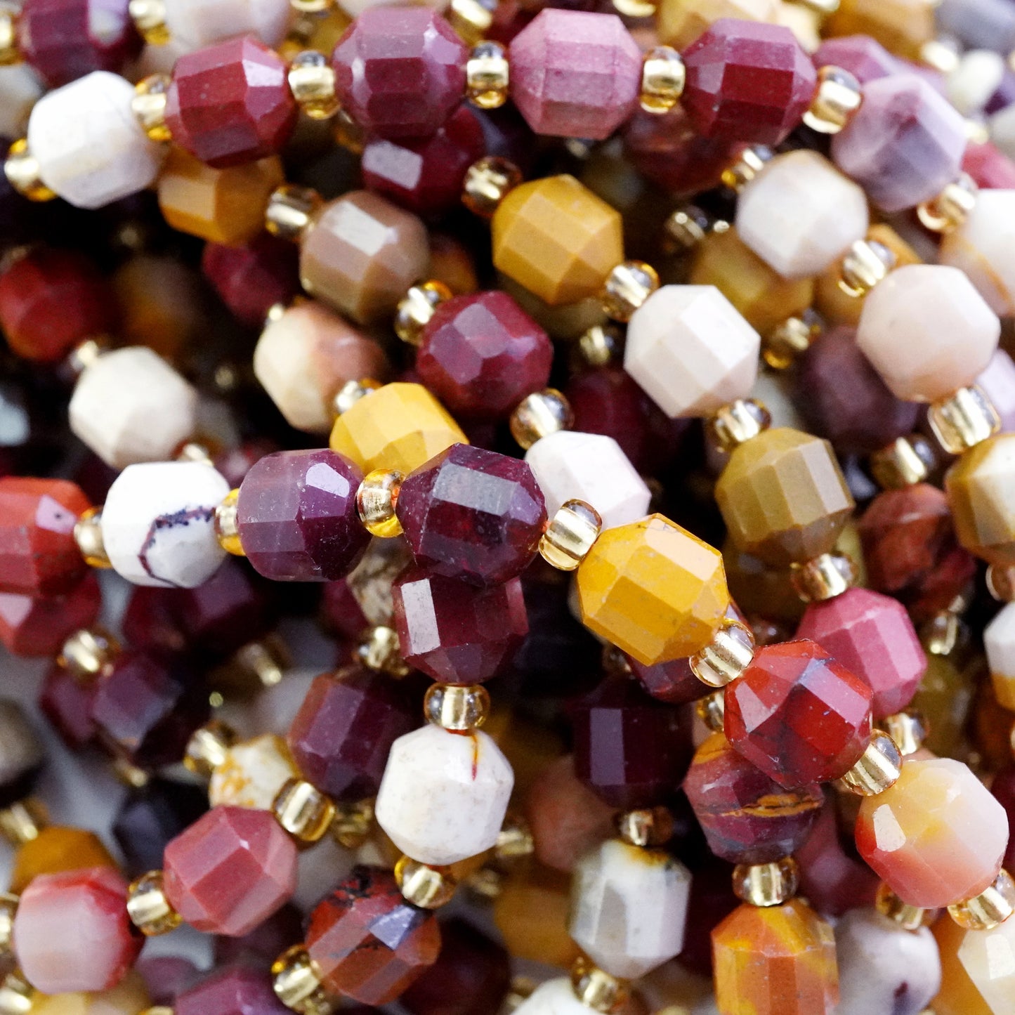 Mookaite (Barrel)(Faceted)(6x5mm)(16"Strand)