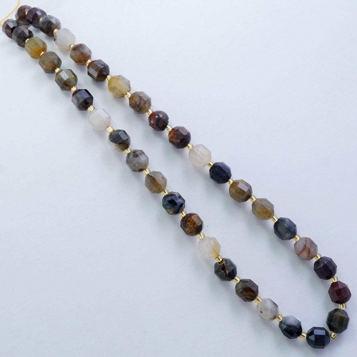 Pietersite in Quartz (Barrel)(Faceted)(8x7mm)(16"Strand)