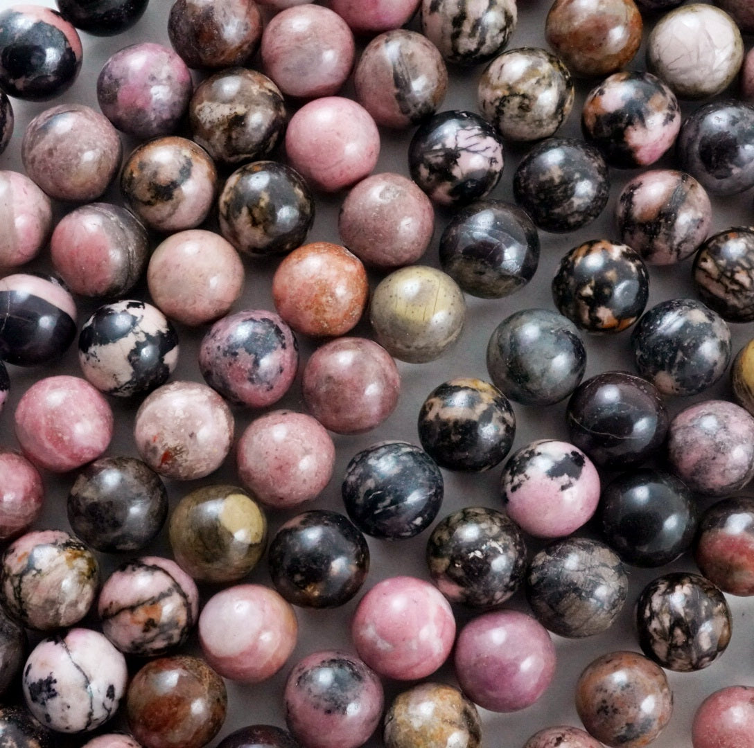 Rhodonite (Round)(Smooth)(4mm)(6mm)(8mm)(10mm)(12mm)(16"Strand)