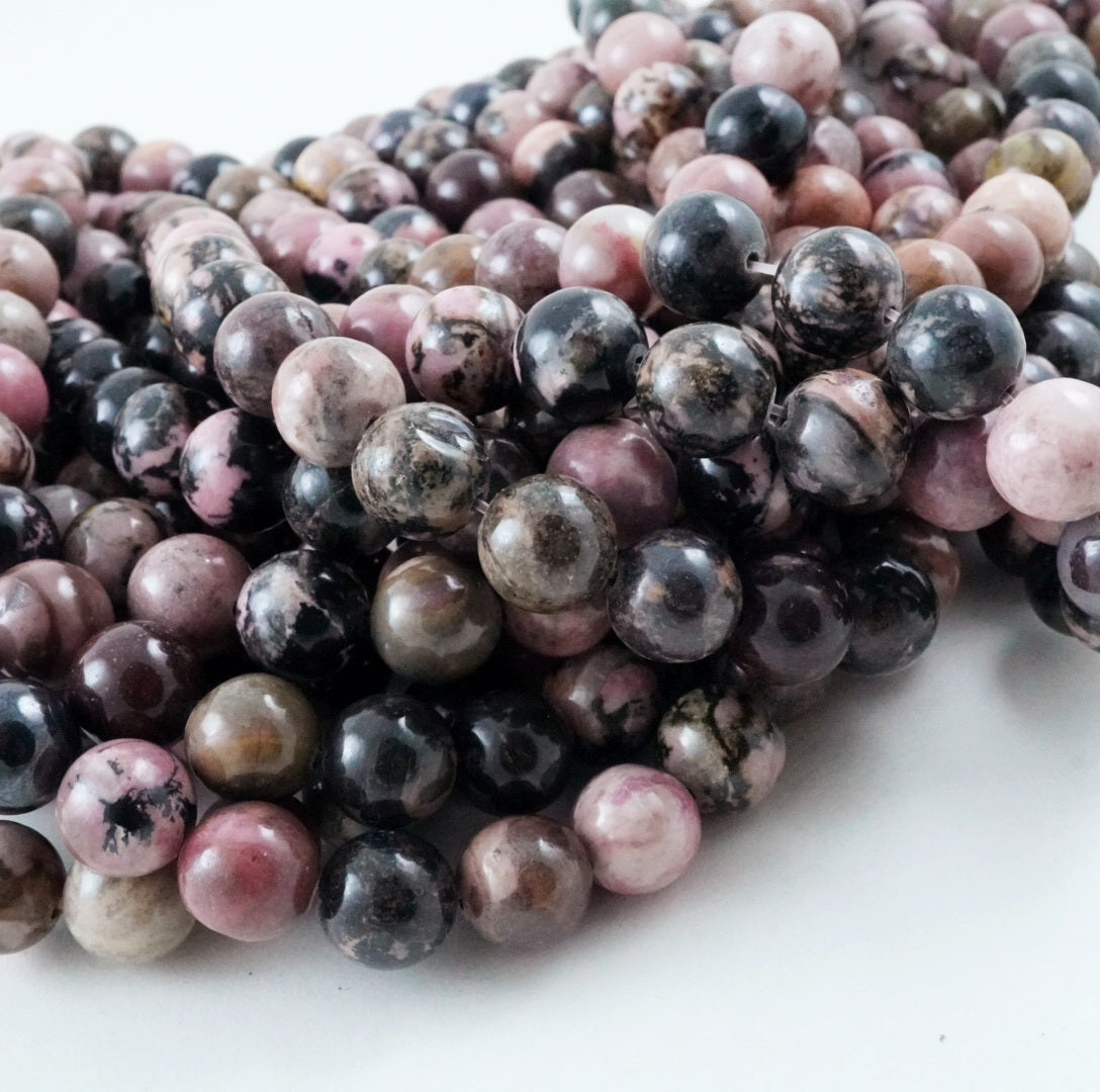 Rhodonite (Round)(Smooth)(4mm)(6mm)(8mm)(10mm)(12mm)(16"Strand)