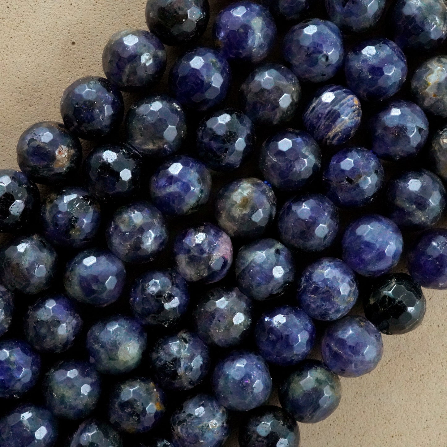 Iolite (Round)(Faceted)(6mm)(8mm)(16"Strand)