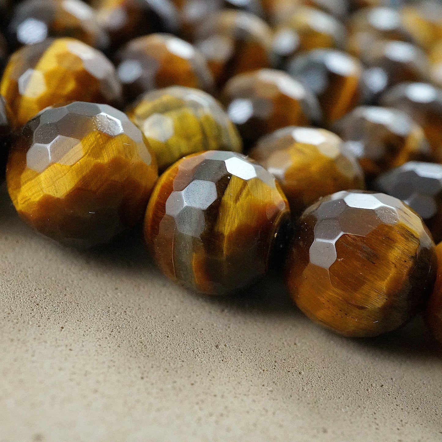 Tiger Eye (Round)(Faceted)(4mm)(6mm)(8mm)(10mm)(12mm)(16"Strand)