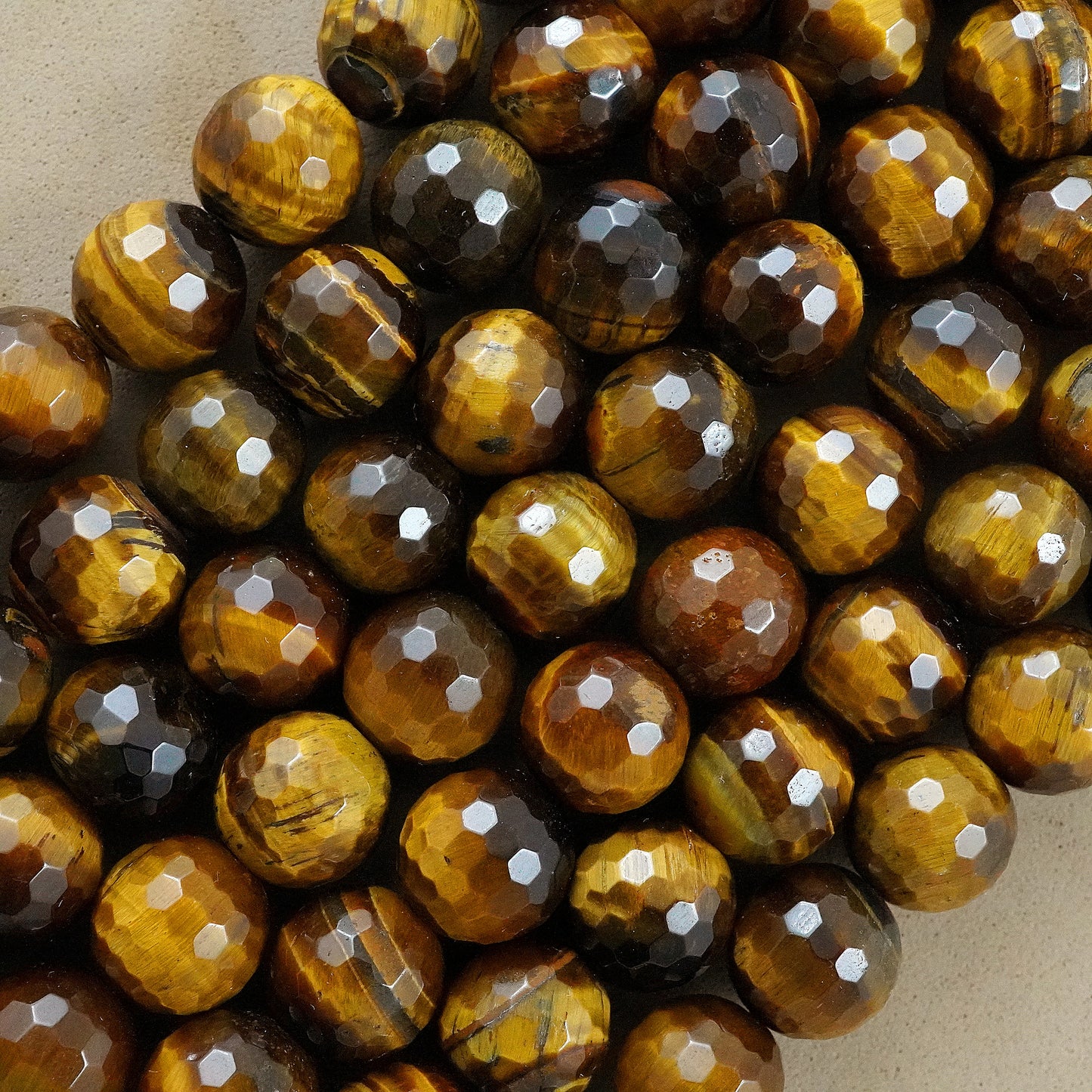 Tiger Eye (Round)(Faceted)(4mm)(6mm)(8mm)(10mm)(12mm)(16"Strand)