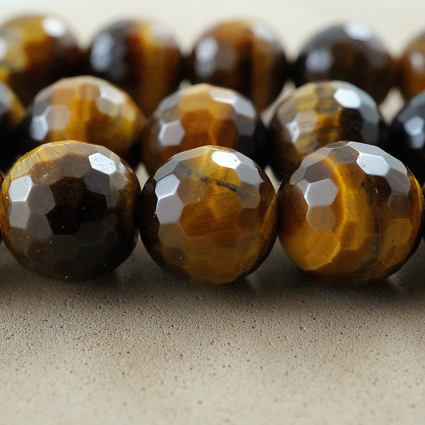 Tiger Eye (Round)(Faceted)(4mm)(6mm)(8mm)(10mm)(12mm)(16"Strand)