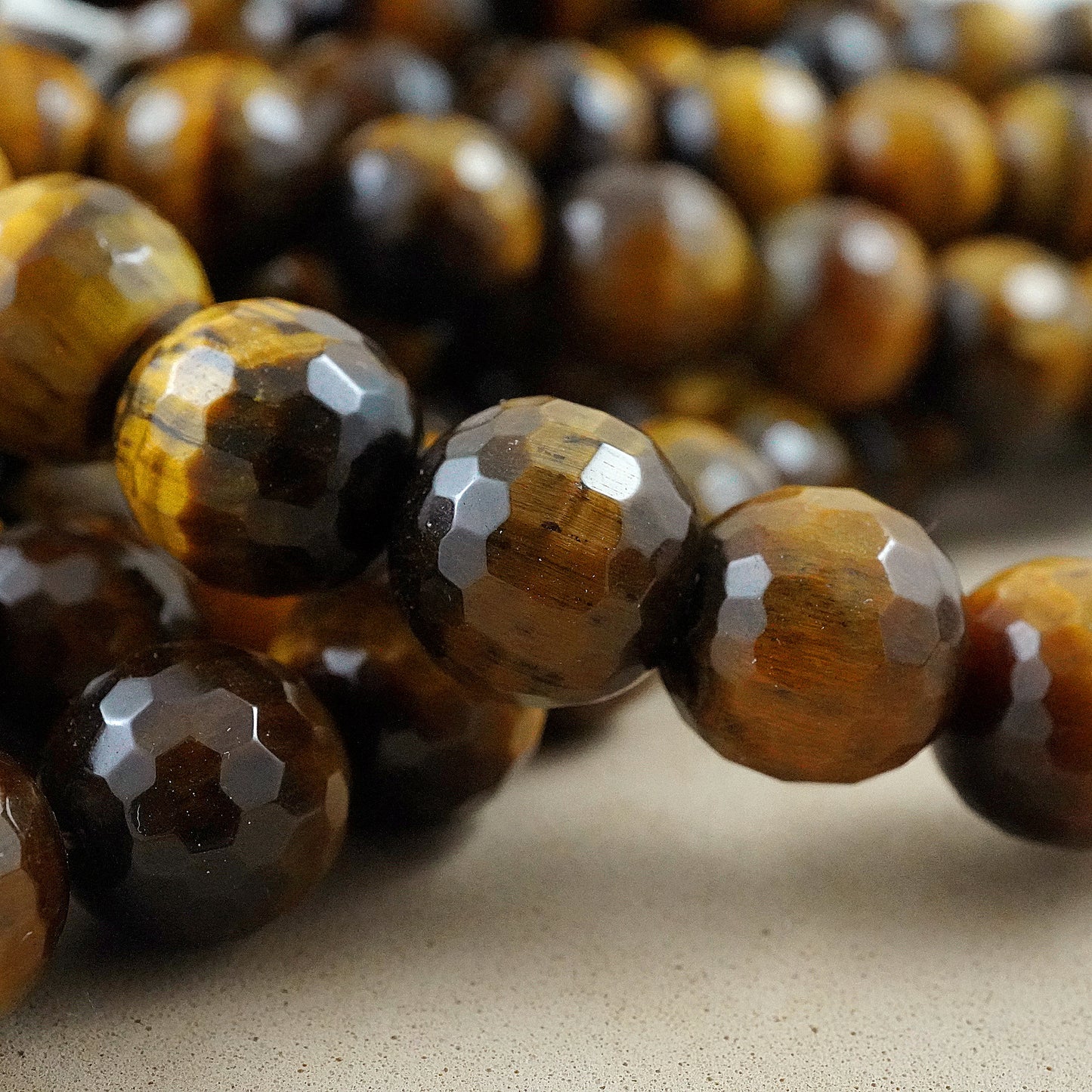 Tiger Eye (Round)(Faceted)(4mm)(6mm)(8mm)(10mm)(12mm)(16"Strand)