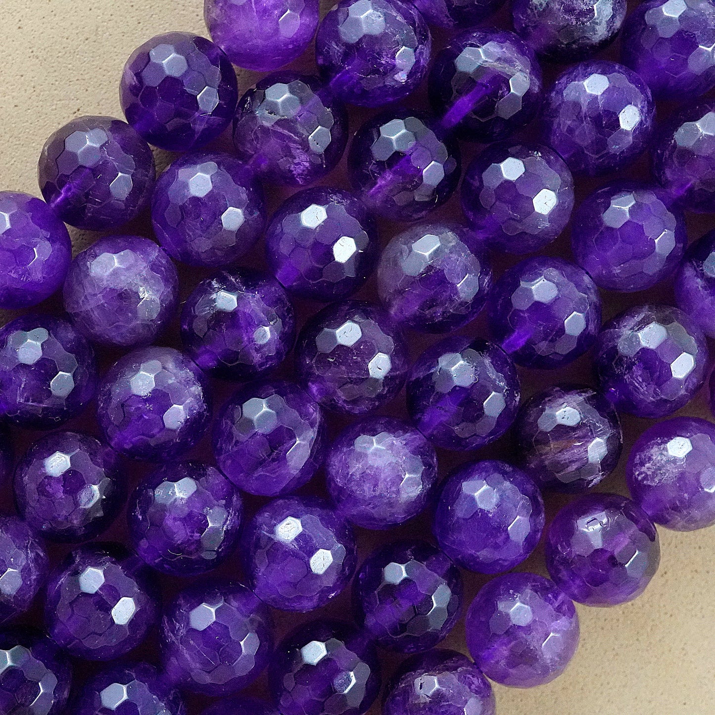 Amethyst (Round)(Faceted)(4mm)(6mm)(8mm)(10mm)(16"Strand)