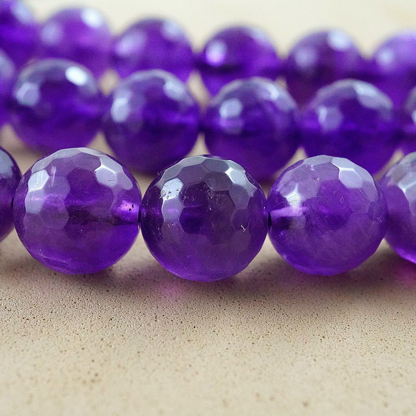 Amethyst (Round)(Faceted)(4mm)(6mm)(8mm)(10mm)(16"Strand)