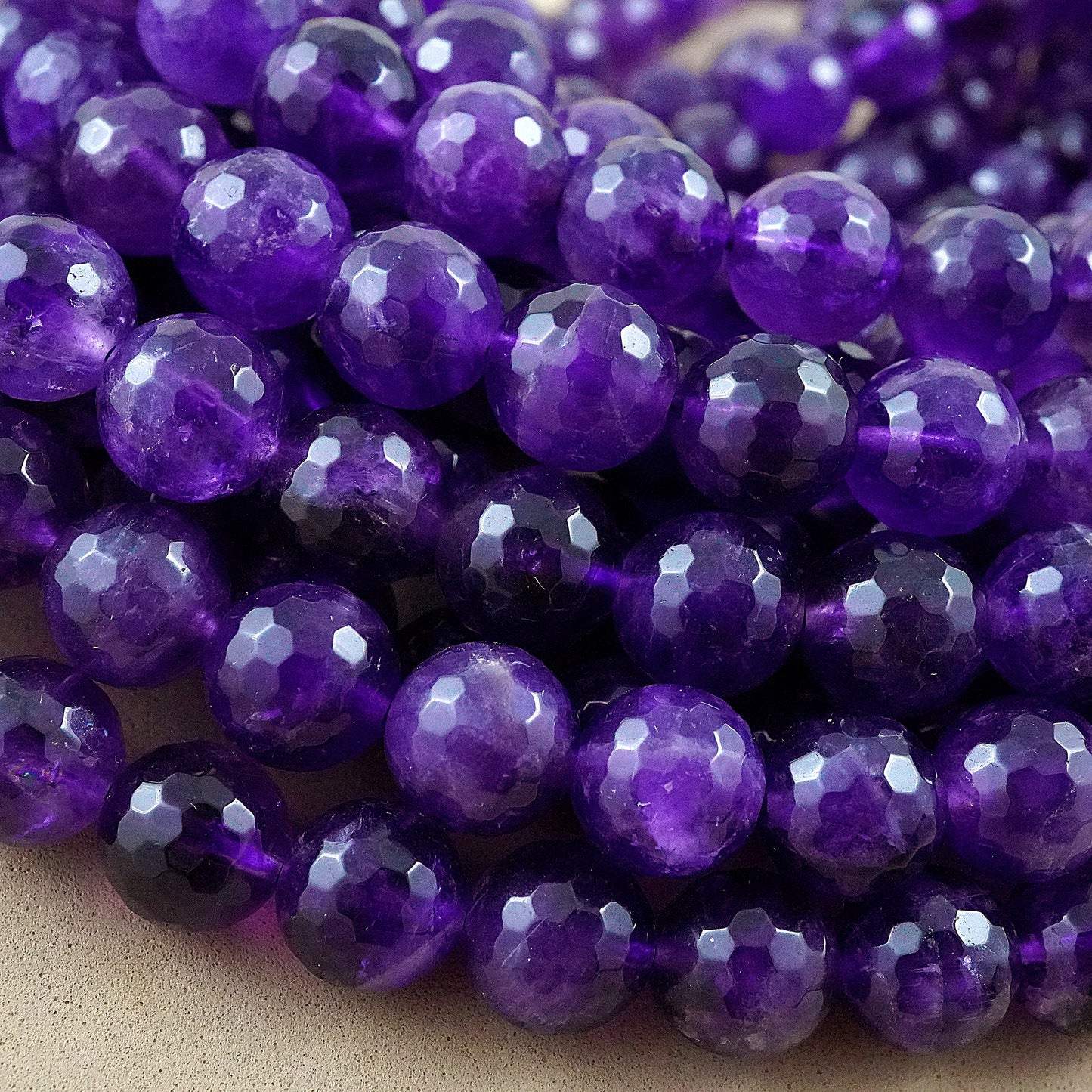 Amethyst (Round)(Faceted)(4mm)(6mm)(8mm)(10mm)(16"Strand)