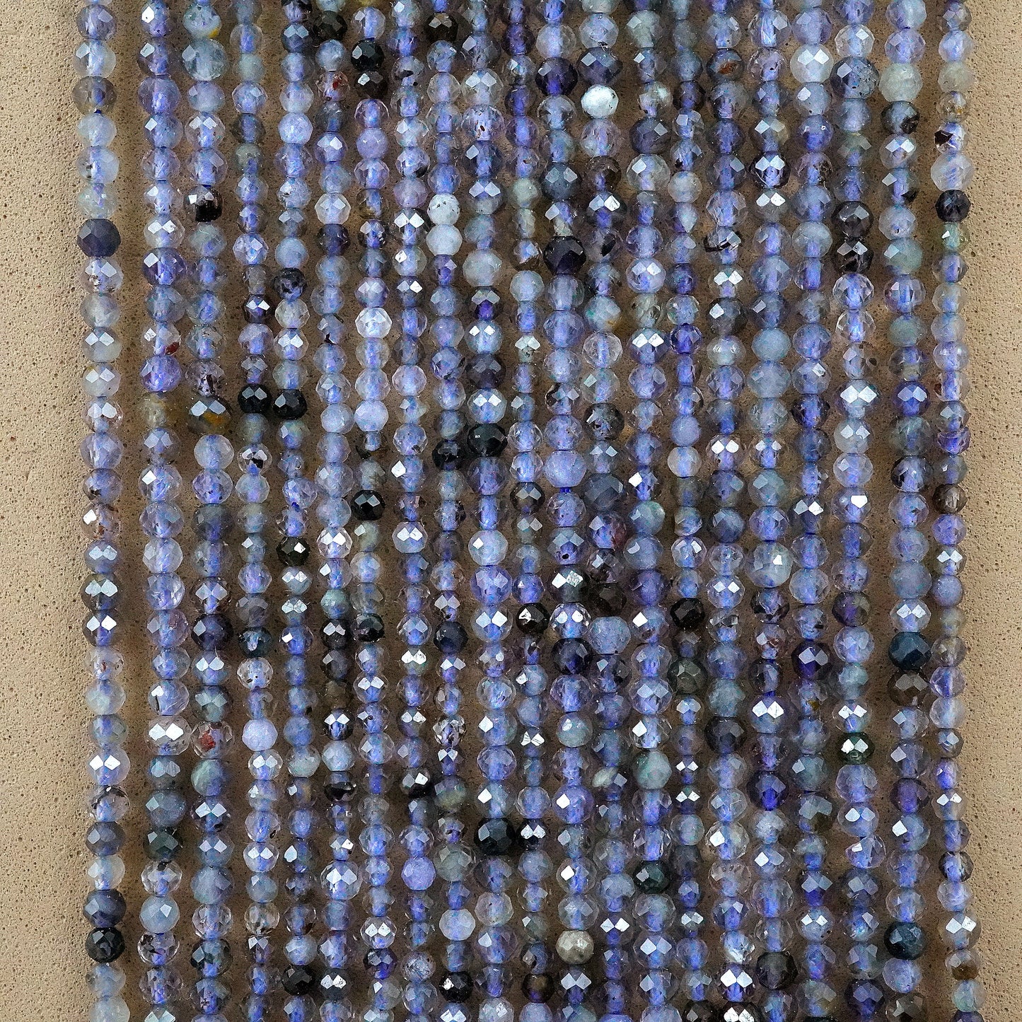 Iolite (Round)(Micro)(Faceted)(2.5mm)(15.5"Strand)