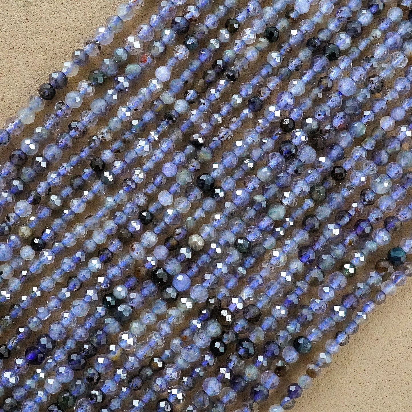 Iolite (Round)(Micro)(Faceted)(2.5mm)(15.5"Strand)