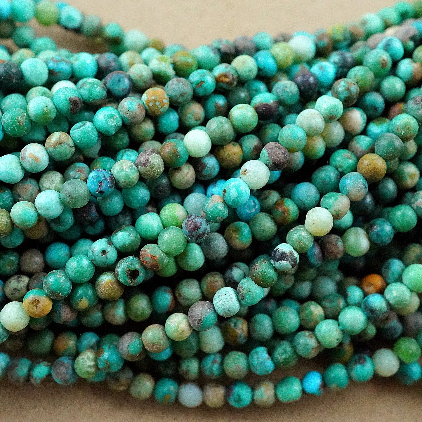 Turquoise (Round)(Smooth)(Medium-Grade)(2mm)(15"Strand)