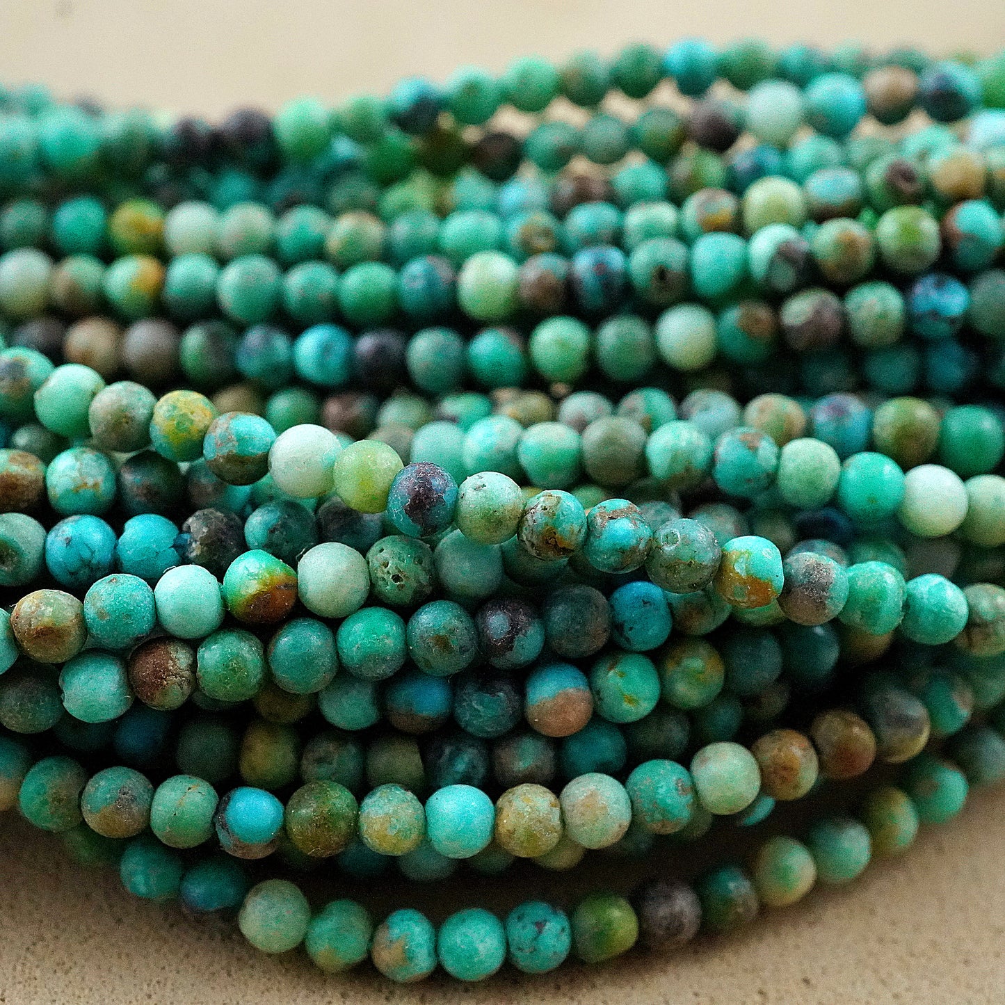 Turquoise (Round)(Smooth)(Medium-Grade)(2mm)(15"Strand)