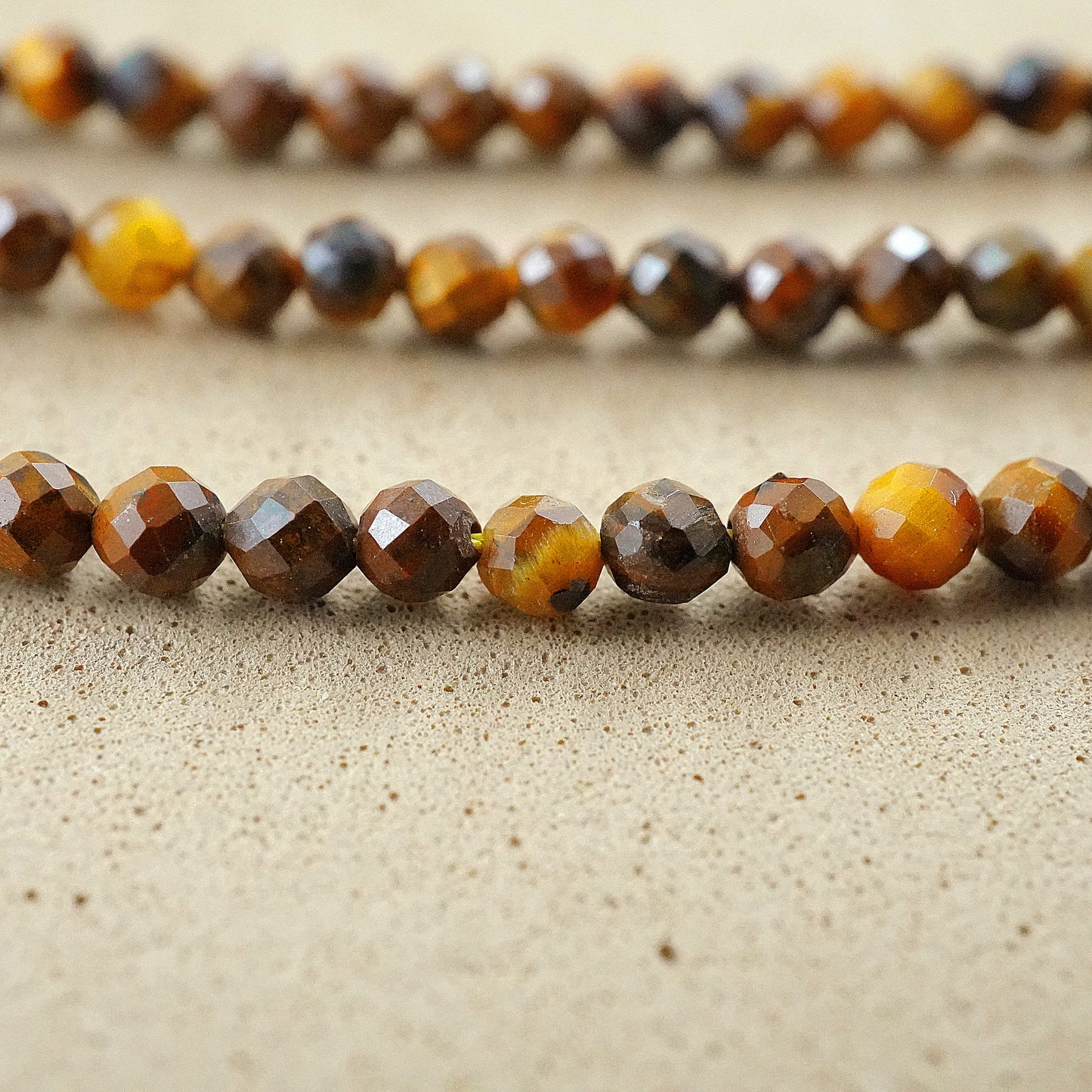 Tiger Eye (Round)(Micro)(Faceted)(2mm)(15"Strand)