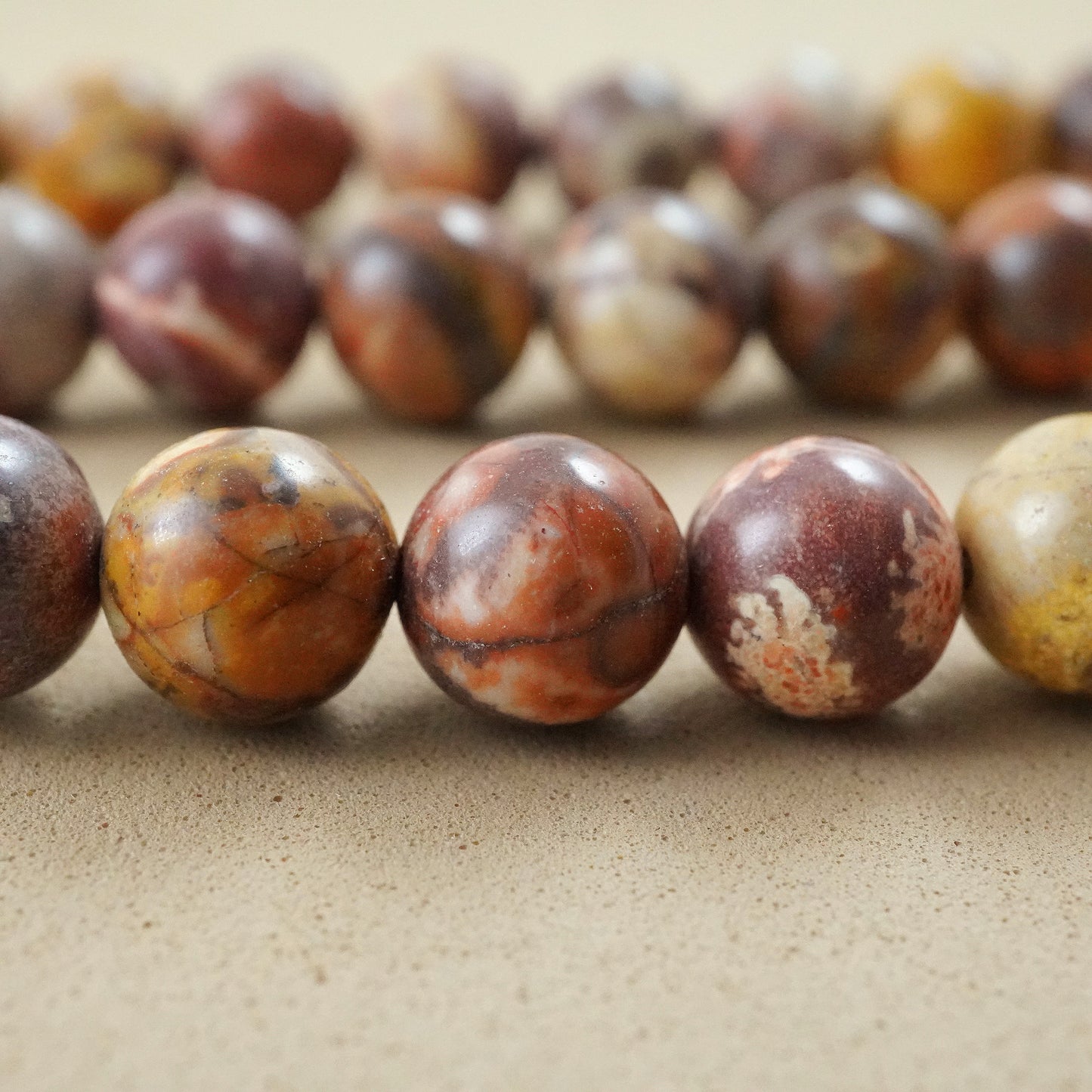 Bird's Eye Rhyolite (Round)(Smooth)(4mm)(6mm)(8mm)(10mm)(15"Strand)