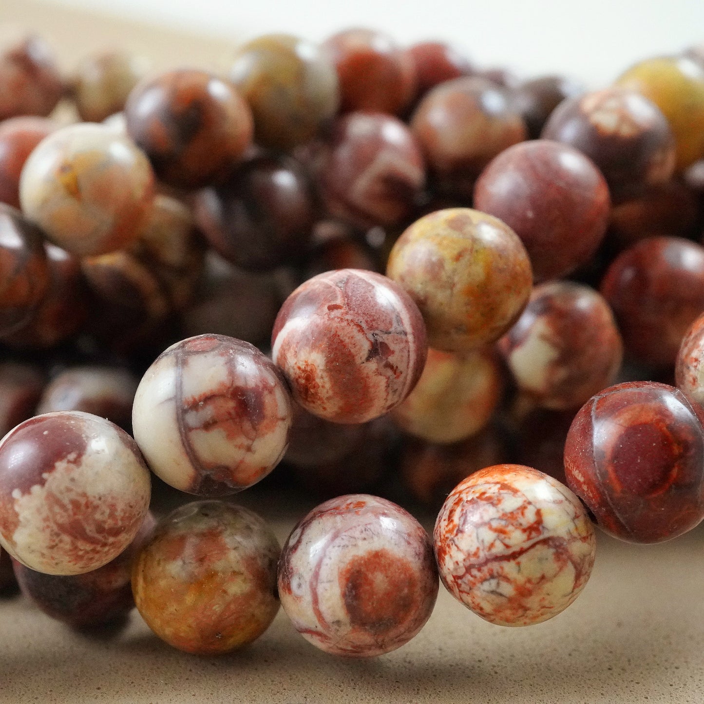 Bird's Eye Rhyolite (Round)(Smooth)(4mm)(6mm)(8mm)(10mm)(15"Strand)