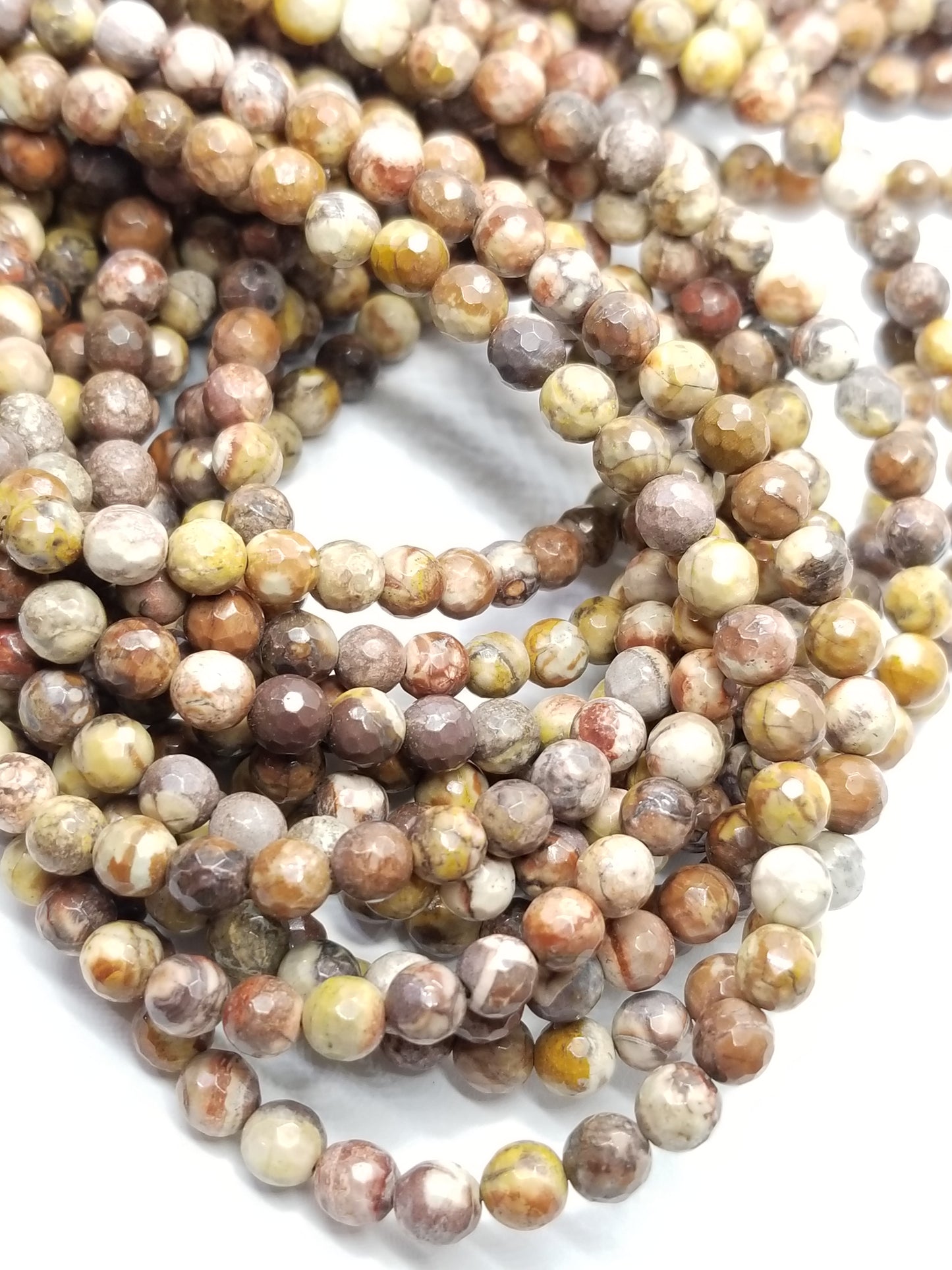 Bird's Eye Rhyolite (Round)(Faceted)(16"Strand)