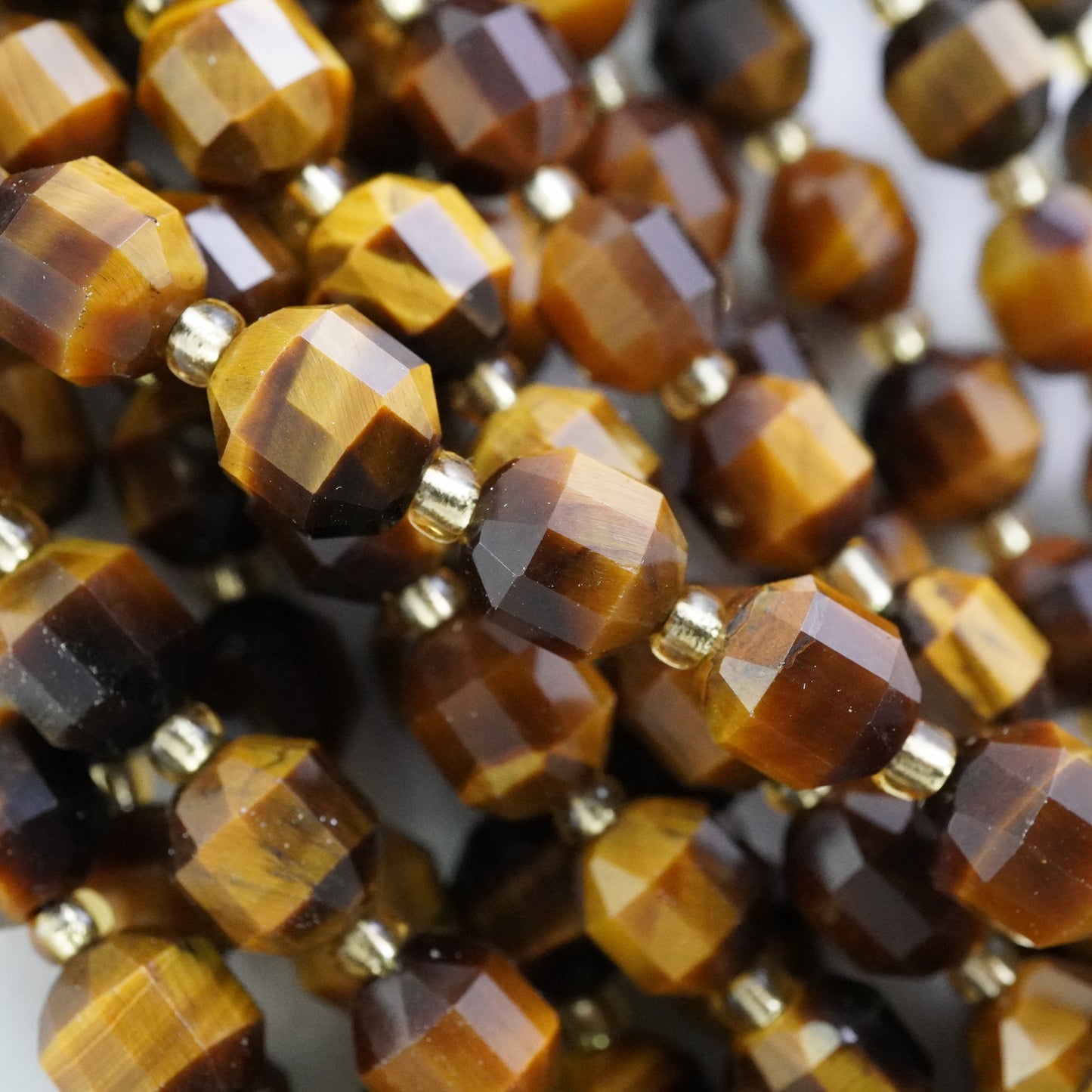 Tiger Eye (Barrel)(Faceted)(8x7mm)(16"Strand)