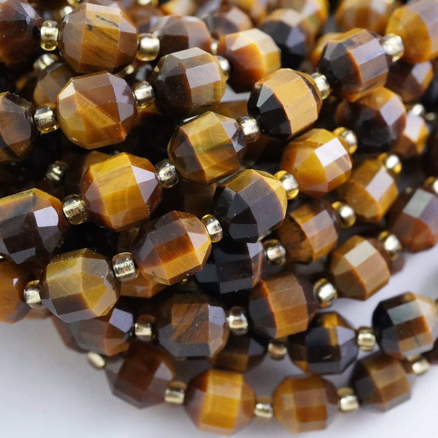 Tiger Eye (Barrel)(Faceted)(8x7mm)(16"Strand)