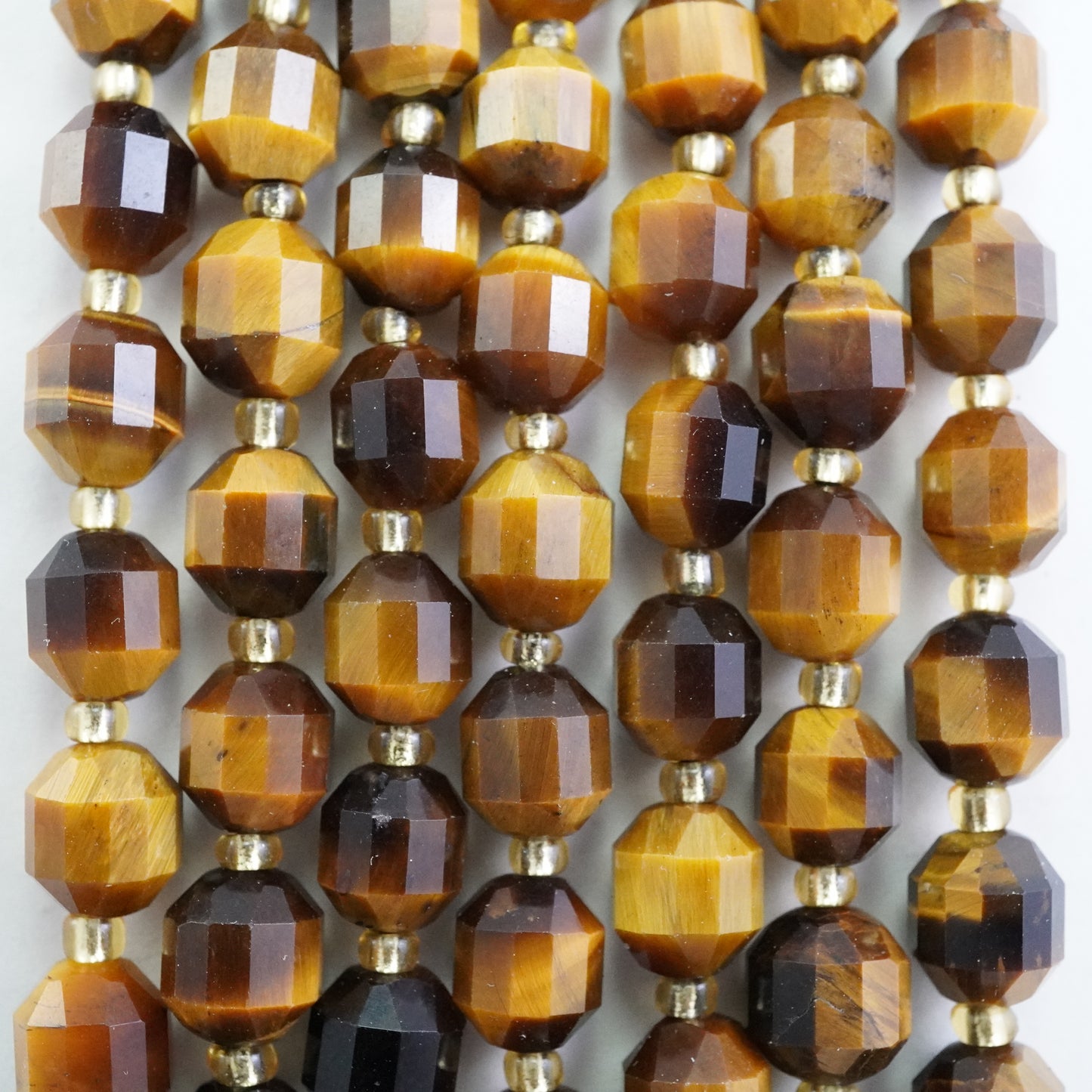 Tiger Eye (Barrel)(Faceted)(8x7mm)(16"Strand)