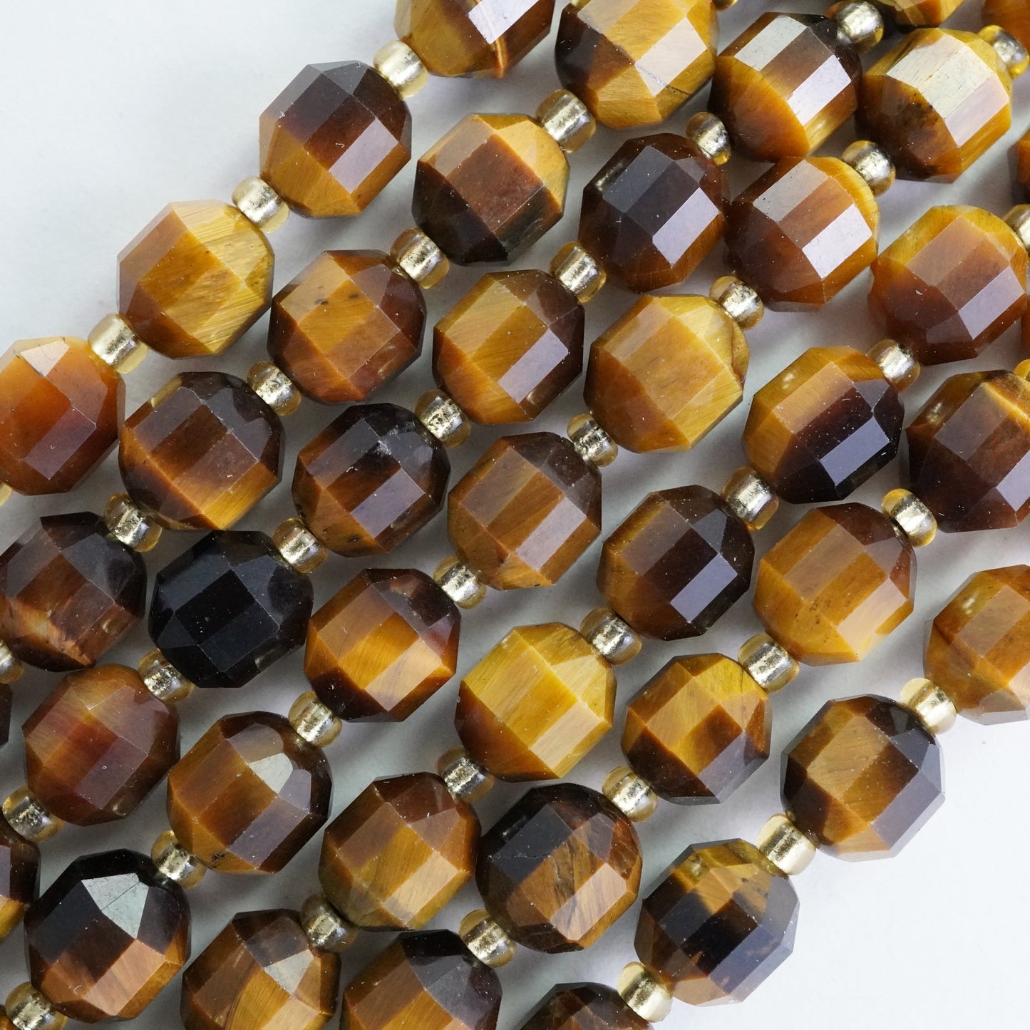 Tiger Eye (Barrel)(Faceted)(8x7mm)(16"Strand)