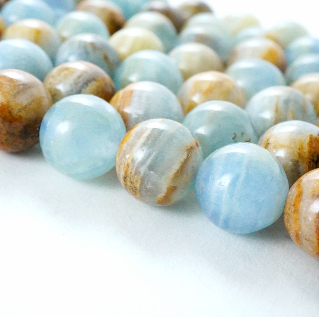 Blue Calcite (Round)(Smooth)(6mm)(8mm)(10mm)(16"Strand)