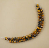 Tiger Eye (Large Hole)(Round)(Smooth)(8mm)(10mm)(8"Strand)