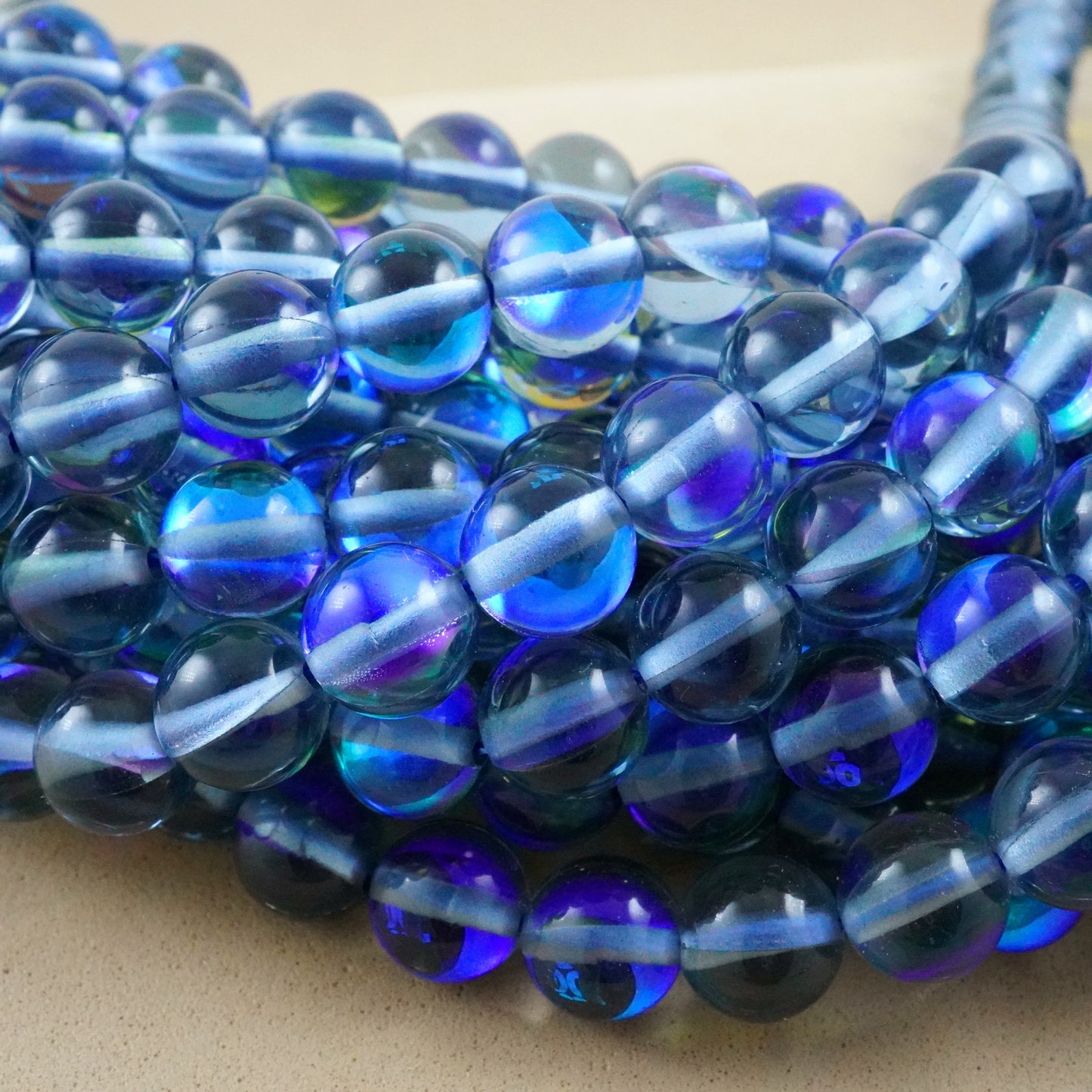 Grey Mystic Aura Quartz (Round)(Smooth)(6mm)(8mm)(10mm)(12mm)(Syn)(16"Strand)