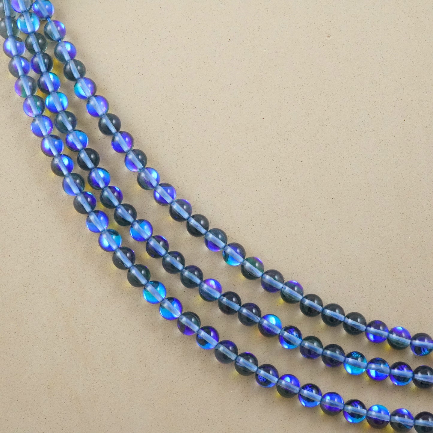 Grey Mystic Aura Quartz (Round)(Smooth)(6mm)(8mm)(10mm)(12mm)(Syn)(16"Strand)