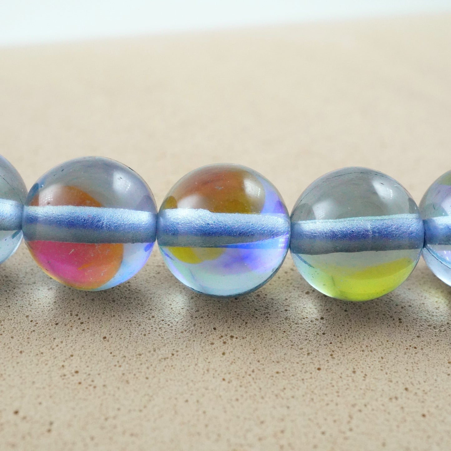 Grey Mystic Aura Quartz (Round)(Smooth)(6mm)(8mm)(10mm)(12mm)(Syn)(16"Strand)