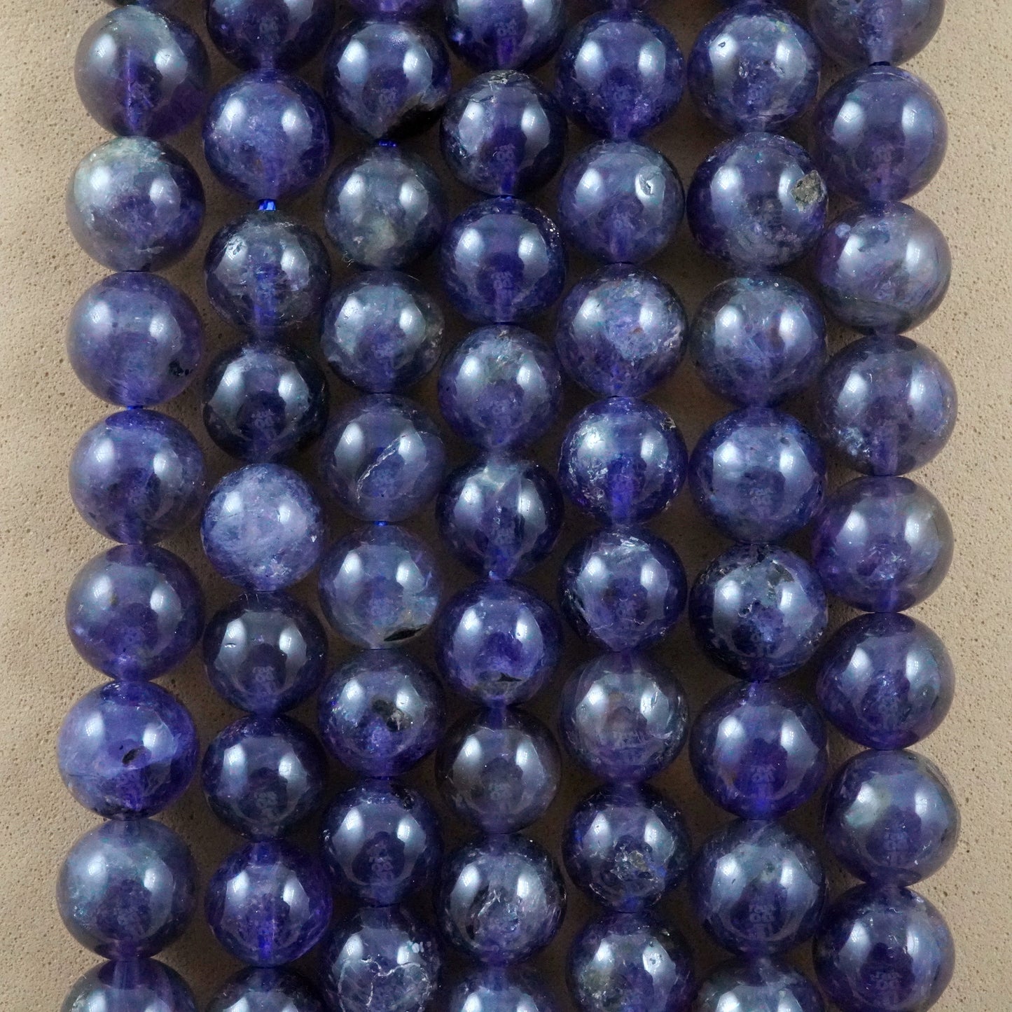 Iolite (Round)(Smooth)(6mm)(8mm)(10mm)(16"Strand)