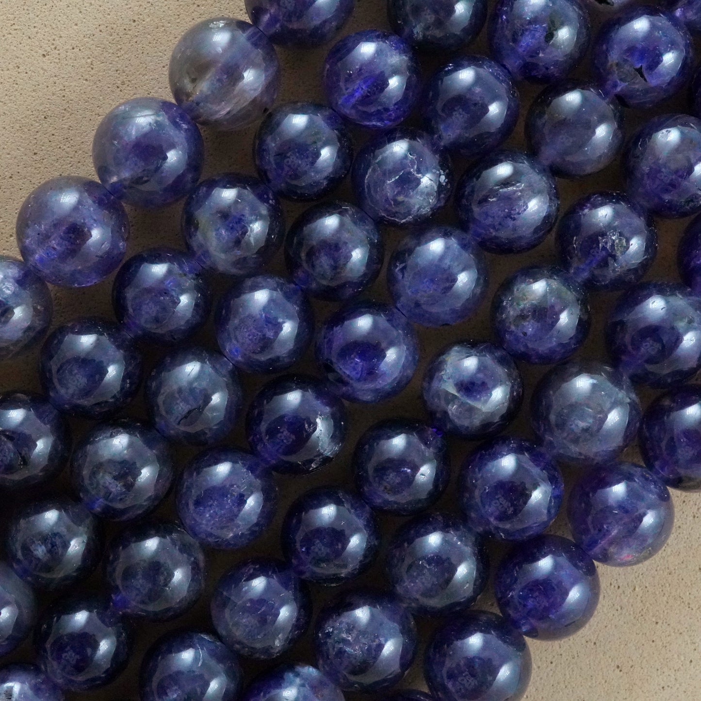 Iolite (Round)(Smooth)(6mm)(8mm)(10mm)(16"Strand)