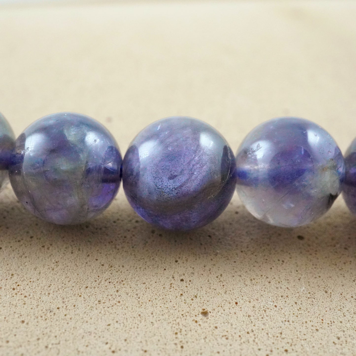 Iolite (Round)(Smooth)(6mm)(8mm)(10mm)(16"Strand)