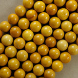 Yellow Mookaite (Round)(Smooth)(4mm)(6mm)(8mm)(10mm)(16"Strand)